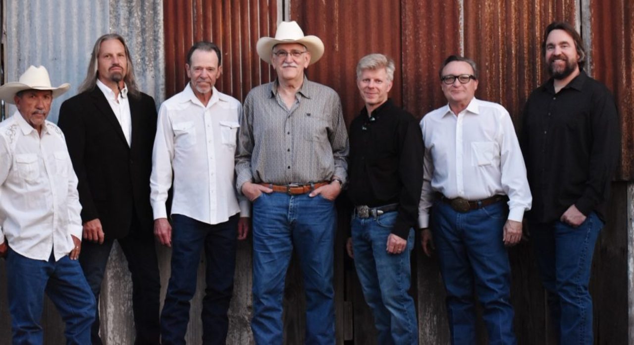 L to R: Mike Daily (steel guitar), Bobby Jarzombek (drums), Benny McArthur (guitar, fiddle, vocals), Rick McRae (guitar, fiddle, vocals), Jon Kemppainen (fiddle, vocals), Ronnie Huckaby (piano), Tom Batts (bass guitar, vocals)